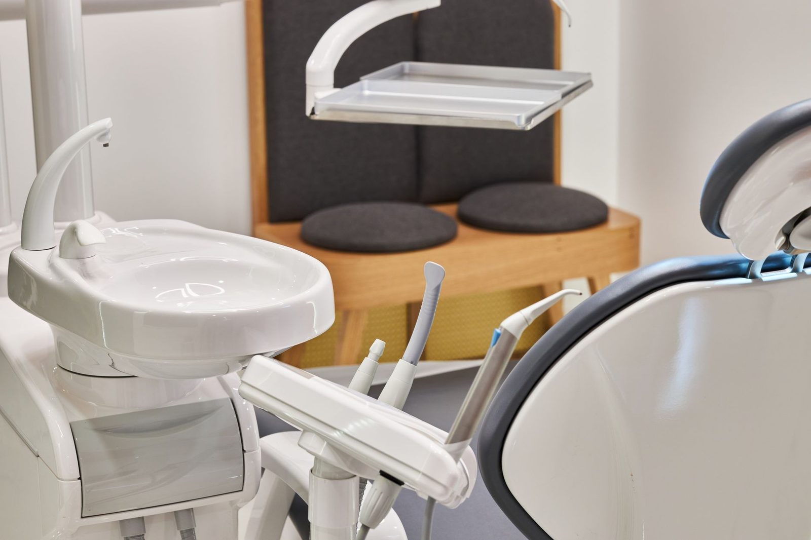 Bright, modern dental clinic interior with dental chair and equipment